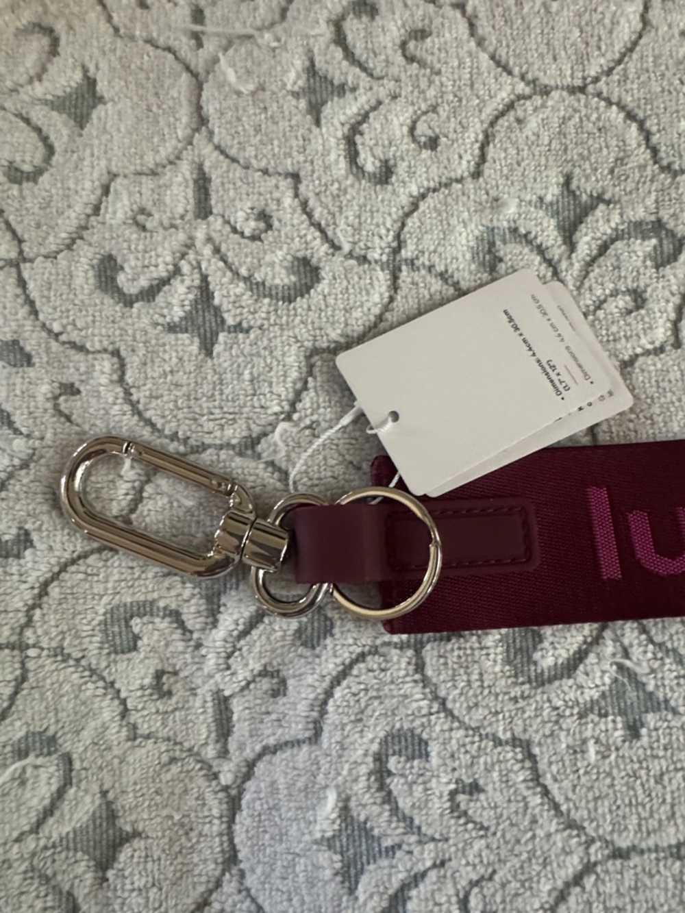 NWT, Lululemon “ never lost  keychain in wine./ pink logo . - Picture 3 of 5